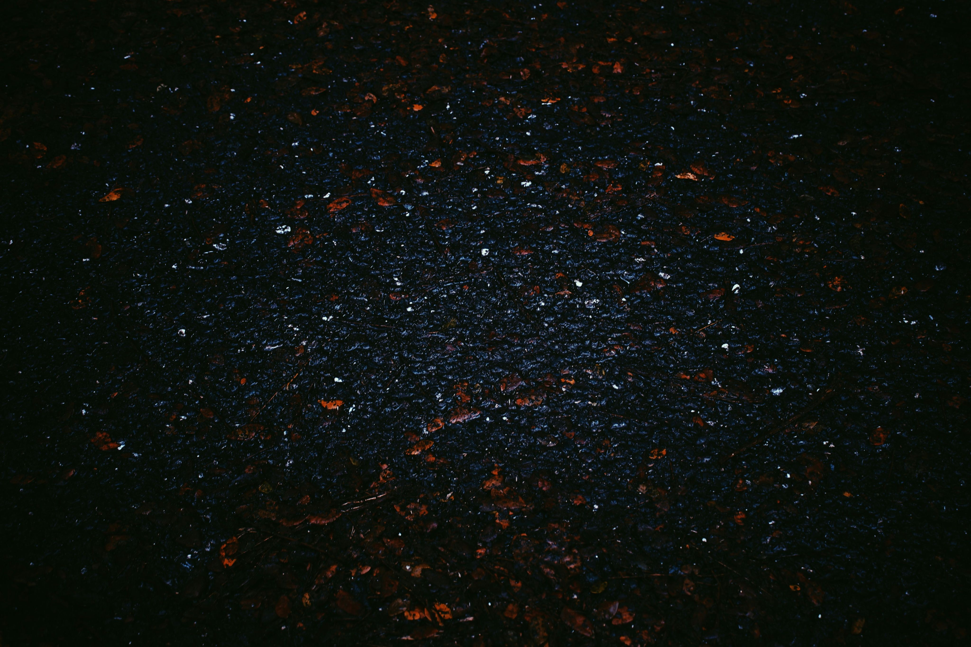 a black background with small red and white speckles